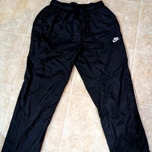 All black Nike splash pants
